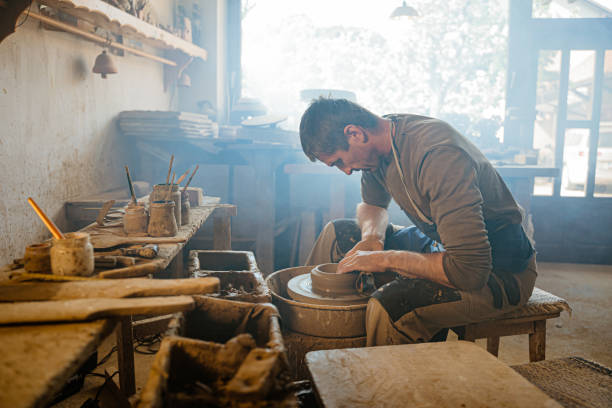 istock Potter working on the potter's wheel 1354084955