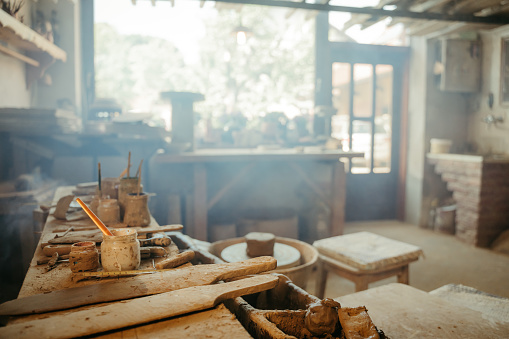 Empty pottery studio with tools on table