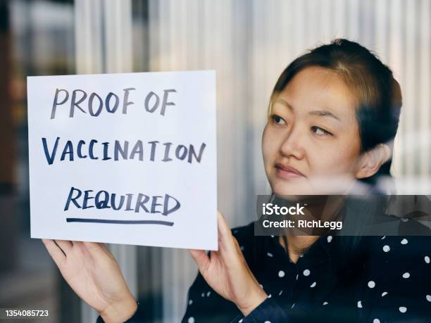 Business Owner Wtih Vaccine Mandate Sign Stock Photo - Download Image Now - Vaccination, Mandate, Proof - Document
