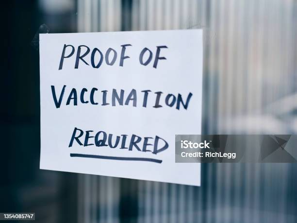 Business Wtih Vaccine Mandate Sign Stock Photo - Download Image Now - Vaccination, Mandate, Proof - Document