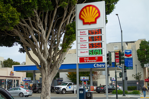 San Francisco, CA - November 18th, 2021: Drivers are paying record high gas prices above $5.00/gallon at stations along HWY 101 on Lombard street.