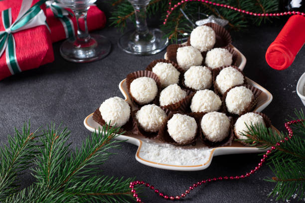 istock Sweet coconut rafaello candies served in plate as Christmas tree. 1354089026
