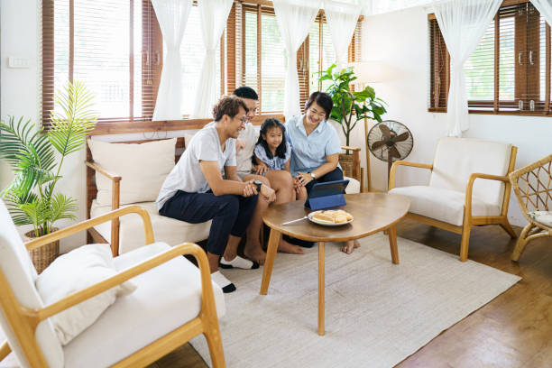 istock Asian parents with Two children at home 1354091315
