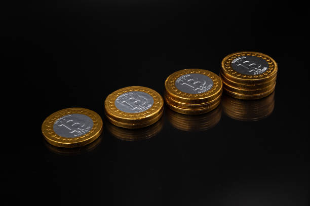 istock Stack of physical bitcoin crypto currency coins on an isolated black background 1354093070