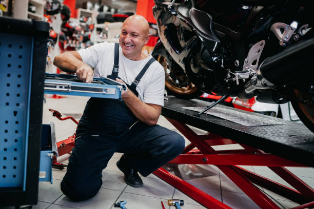 istock Mechanic repairing motorcycle 1354096748