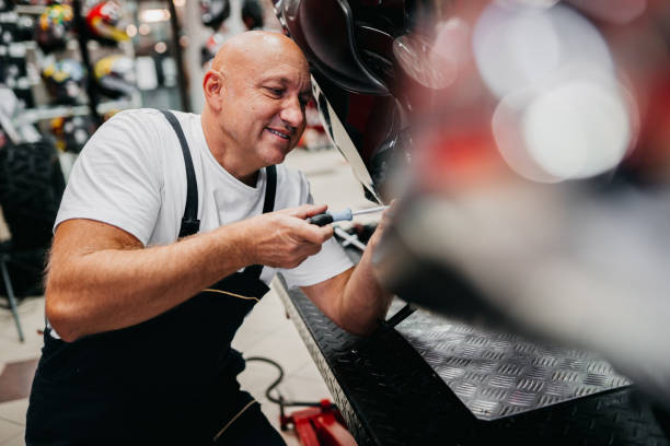 istock Mechanic repairing motorcycle 1354101067