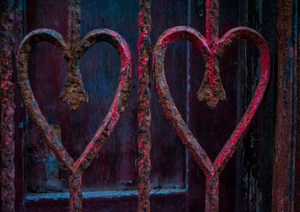 istock Two heart shapes on a doorway. 1354105152