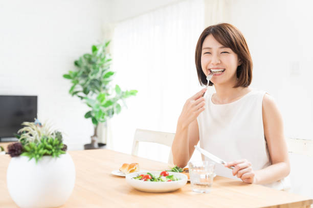 istock attractive asian woman who eats 1354109240