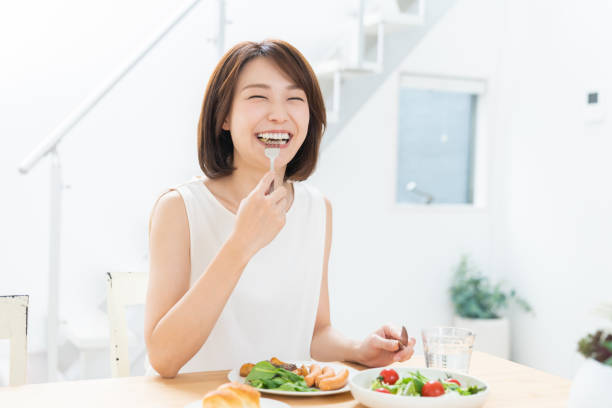istock attractive asian woman who eats 1354109251