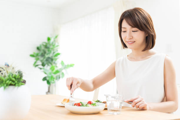 istock attractive asian woman who eats 1354109270