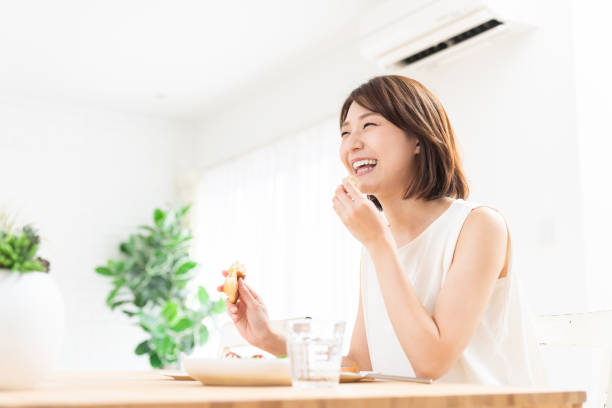 istock attractive asian woman who eats 1354109313