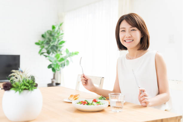 istock attractive asian woman who eats 1354109353