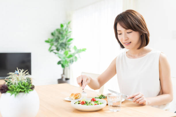 istock attractive asian woman who eats 1354109915