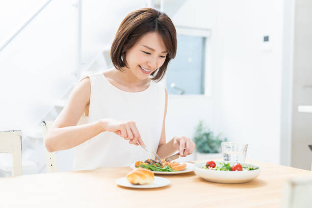 istock attractive asian woman who eats 1354109969