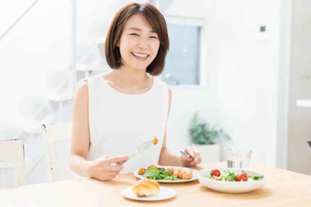 istock attractive asian woman who eats 1354110129
