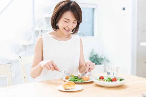 istock attractive asian woman who eats 1354110176