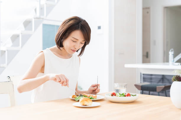 istock attractive asian woman who eats 1354110379