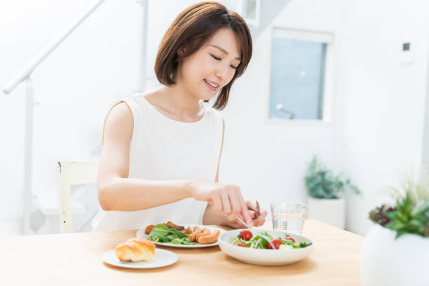 istock attractive asian woman who eats 1354110389