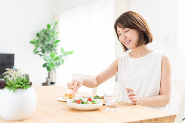 istock attractive asian woman who eats 1354110474