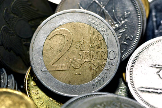 istock The 2 euro coin (€2) closeup with different coins background 1354111721
