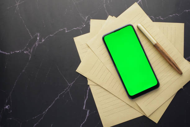istock top view of smart phone and notepad on table 1354115455
