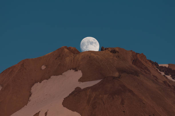 istock Full moon rising over crater on Mt. Lassen 1354118407