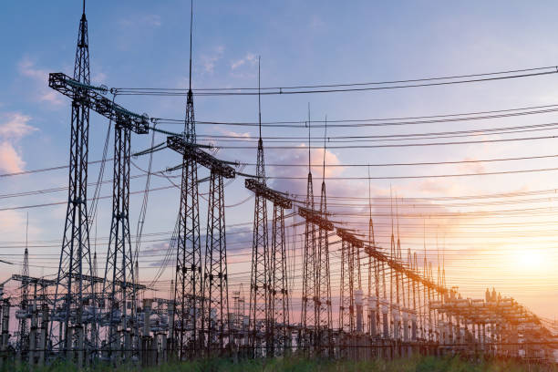 istock power line pylons during sunset with beautiful saturated sky. distribution transmission and consumption of electricity 1354124153