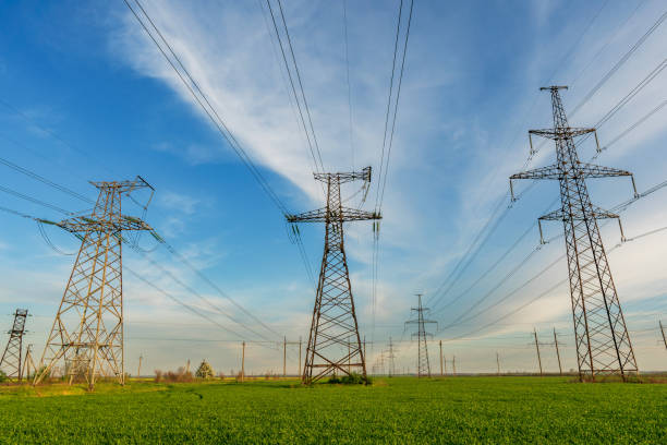 istock power lines in the spring in a green wheat field 1354125253