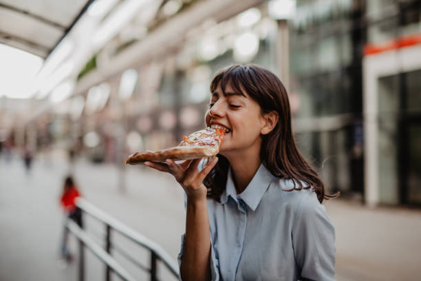 Businesswoman having a quick lunch