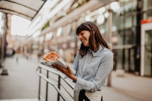 istock Businesswoman having a quick lunch 1354125333