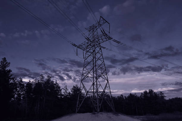 istock power line pylons at night with beautiful saturated sky. 1354125356