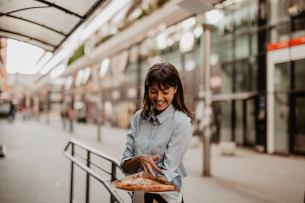 istock Businesswoman having a quick lunch 1354125382