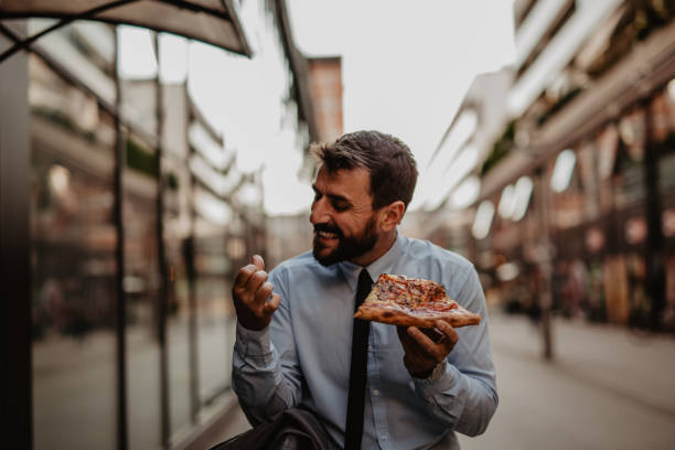 istock Successful businessman eating lunch 1354126347