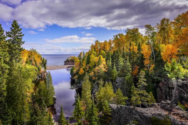 istock Cloudy sky over Baptism River at Tettegouche State Park, Minnesota 1354127455