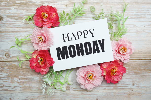 istock Happy Monday text with Blooming flower on wooden background 1354130150