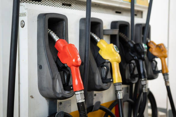 istock Row of refuel nozzle head at gasoline station. 1354130264