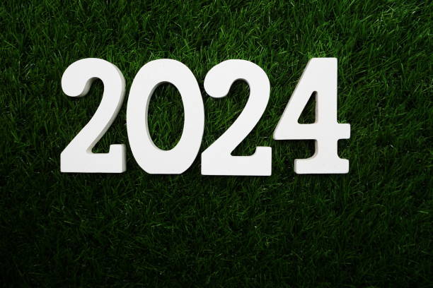istock 2024 Happy New Year Flat lay on Green artificial grass 1354130434