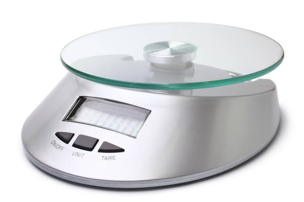 Digital kitchen scales Digital kitchen scales on a white background kitchen scale stock pictures, royalty-free photos & images