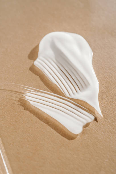 istock The texture of the white cream on a beige background. 1354133645