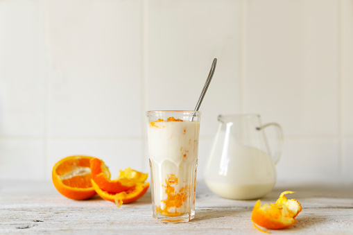Natural yoghurt with fresh orange. Breakfast