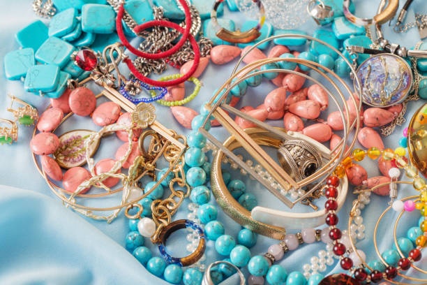 istock different women's jewelry on blue fabric 1354139660
