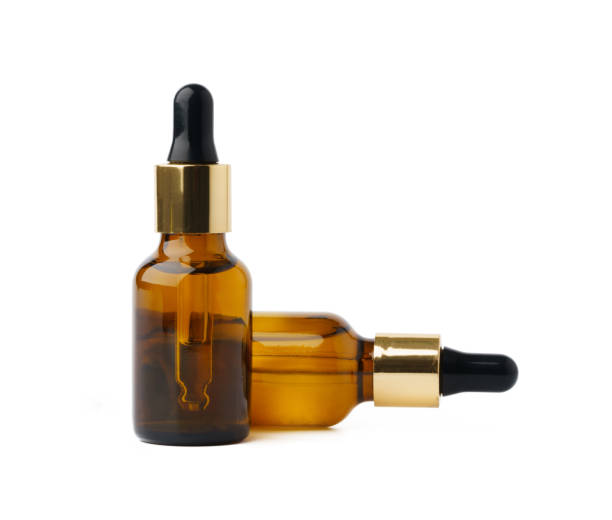istock Bottles with essential oil isolated on white background 1354142315