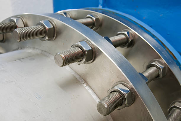 istock Closeup of a machinery's nuts and bolts 135414407