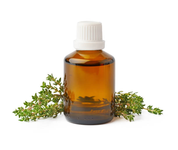 istock Bottle with essential oil and green leaf isolated on white background 1354150220