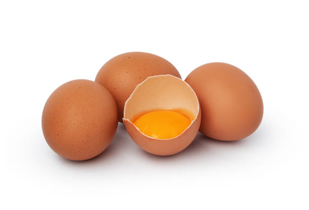 istock Brown raw eggs and one broken isolated on white background 1354152338
