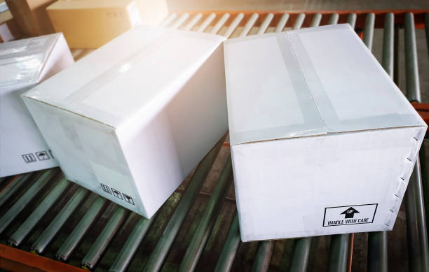 istock Package Boxes Moving on Conveyor Belt. Supply Chain. Cartons Packaging Storehouse. Shipment Parcel Boxes Distribution Shipping Warehouse Logistics. 1354152541