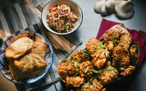 Plant Based Chicken Style Deep Fried Golden Oyster Mushrooms with Coleslaw and Vegan Drop Biscuits All plant based foods without animal body parts or dairy products. All vegan, all delicious and healthy. oyster mushroom stock pictures, royalty-free photos & images