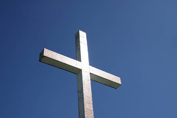 Crucified in the sky Crucifix doing battle in the blue sky going up the mountain Cesen near Valdobiadene. what mountain was jesus crucified on stock pictures, royalty-free photos & images
