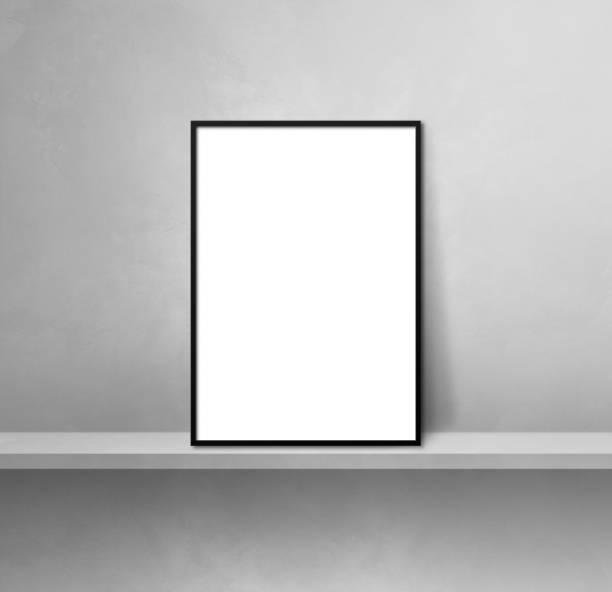 istock Black picture frame leaning on a grey shelf. 3d illustration. Square background 1354155022