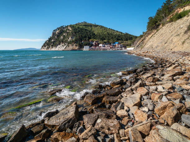 Black Sea rocky coast and pebble beach. The bay of the village of Dzhankhot. stock photo
